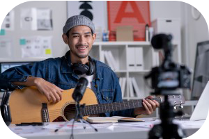 Image of smiling male guitar tutor infrom of a camera